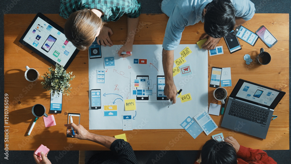  top view of developer team sharing idea of ux ui design by using mind map. top down view of group of