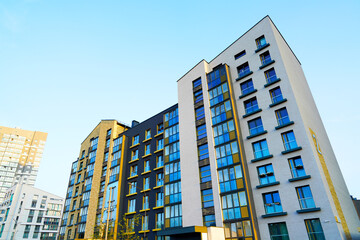 Modern facade building. Colorful high rise urban Modern house. Windows of Skyscraper. Architecture building exterior, window house block. High Rise house. Residential development in UK. City built.