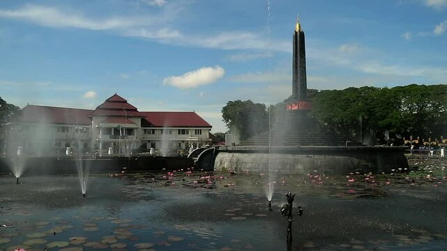 Alun-Alun Tugu is a round square located in front of the City Hall of Malang City, East Java. The square was built in 1920 by the Dutchman Thomas Karsten, surrounded by fountains and lotus ponds. 