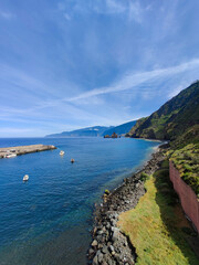 beautiful landscape with boats on the sea near rocky mountains  on the island of Madeira in Portugal