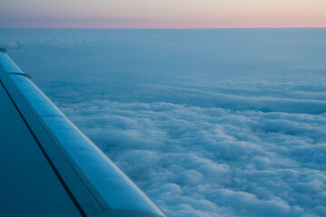 beautiful thick clouds in the sky from the height of the flight of the plane with a view of the...