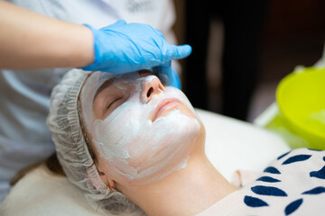 close-up of a girl's face at a cosmetologist during treatment procedures