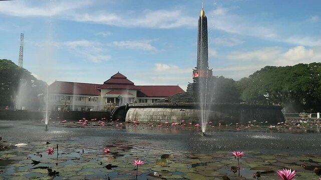 Alun-Alun Tugu is a round square located in front of the City Hall of Malang City, East Java. The square was built in 1920 by the Dutchman Thomas Karsten, surrounded by fountains and lotus ponds. 