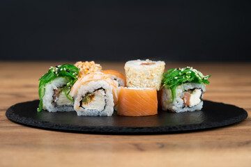 delicious traditional Japanese sushi and rolls on a plate