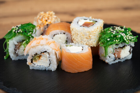 delicious traditional Japanese sushi and rolls on a plate