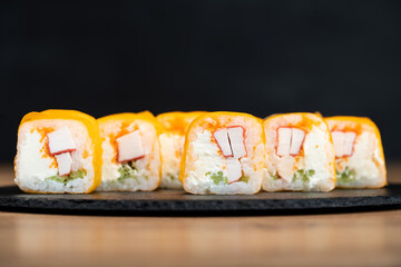 delicious traditional Japanese sushi and rolls on a plate