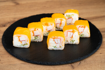 delicious traditional Japanese sushi and rolls on a plate