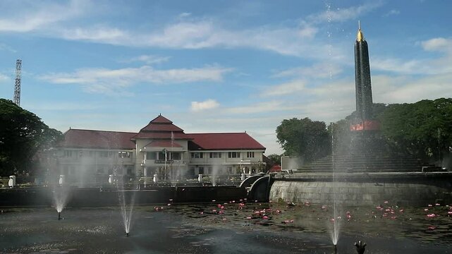 Alun-Alun Tugu is a round square located in front of the City Hall of Malang City, East Java. The square was built in 1920 by the Dutchman Thomas Karsten, surrounded by fountains and lotus ponds. 