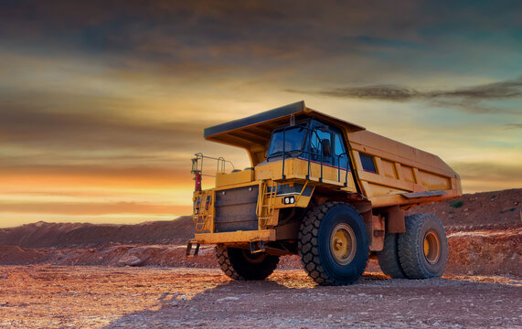 Mining truck in open-pit mining. Heavy machinery Construction equipment. Haul truck at construction site. Mining civil works, Earthmoving. Off highway Trucks on construction. Haul dump truck on sunset