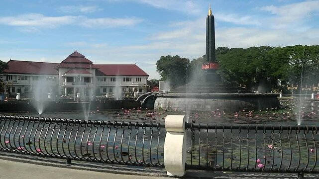 Alun-Alun Tugu is a round square located in front of the City Hall of Malang City, East Java. The square was built in 1920 by the Dutchman Thomas Karsten, surrounded by fountains and lotus ponds. 