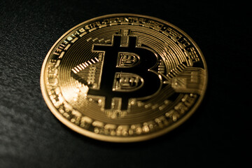 Golden Bitcoin Coin on Black Background