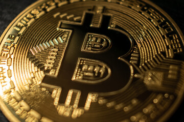 Golden Bitcoin Coin on Black Background