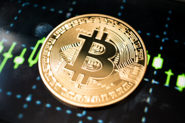 Golden Bitcoin Coin on Futuristic Digital Technology Background