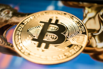 Golden Bitcoin Coin on Futuristic Digital Technology Background