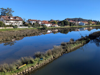 Fototapeta premium Houses and Ribadesella stuary, Asturias, Spain