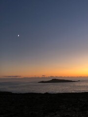lonely island in sunset sea