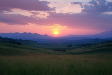 Obraz premium Beautiful sunset over mountains and hills of pastures and farms in Kisoro, Uganda, with a colorful sky and incredible landscape