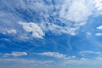A stunning blue sky filled with fluffy white clouds creates a serene and peaceful atmosphere. Ideal...