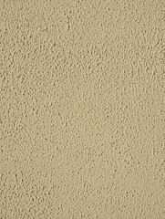 Ivory beige paint wall texture or background with gotele, grainy, textured, scratched, rough and scratchy effect for typical Mediterranean house, chalet and villa exteriors in Spain.