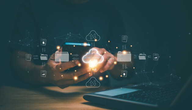 Document Management System (DMS). Database storage cloud technology file data transfer sharing. Businessman using smartphone and laptop for share data by cloud computing system. Backup information.