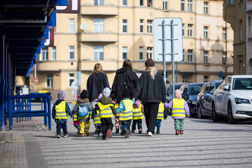 Kindergarten teachers walk with children