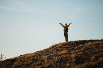 Female hiker enjoying in view at mountain