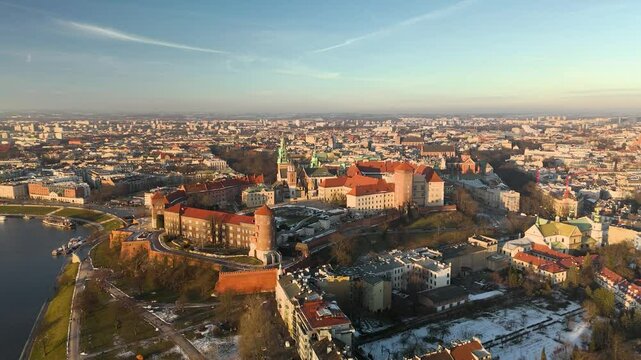Wawel at sunset, panoramic circular aerial shot in winter.