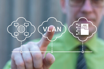 Business person using virtual touch screen push abbreviation: VLAN. VLAN Virtual Local Area Network...