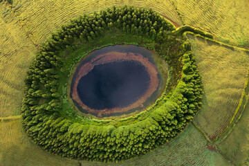 Aerial view of beautiful lagoon in Azores islands. Drone landscape with lines and textures in the background. Top view of volcanic crater, tourist attraction of Portugal.