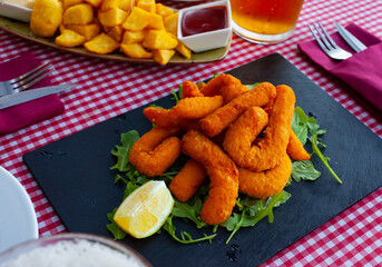Sepia breaded and fried closeup (chocos, typical tapa in Spain)