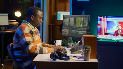 Video editor working on creative software to create a film montage, using color correction wheel...