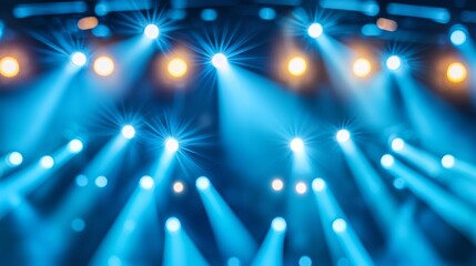 Blurry perspective of a nighttime concert-style seminar, with stage lights and attentive participants immersed in the moment