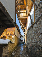 Winter Sunset view of Village of Kovachevitsa with Authentic nineteenth century houses, Blagoevgrad...