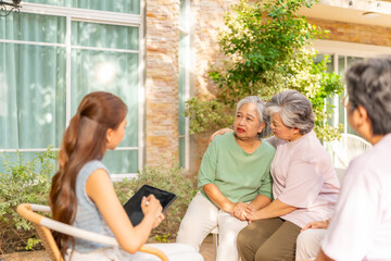 Caregiver, mental healthcare therapy and wellness in elderly people. Group of Asian senior mature...