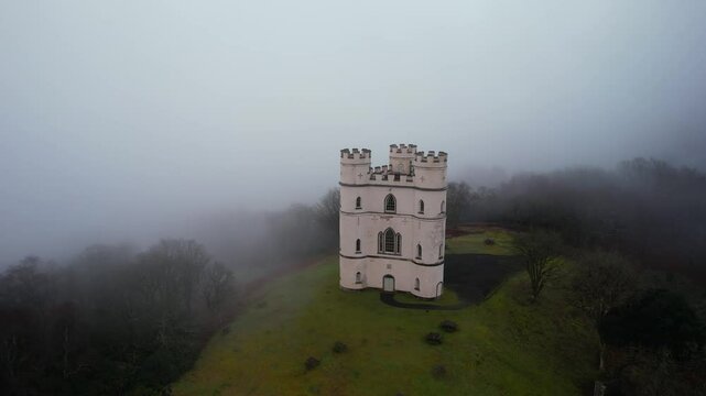 Misty morning over Haldon Belvedere from a drone, Lawrence Castle, Higher Ashton, Exeter, Devon, England