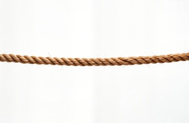 Single light brown rope lies on white background. Natural material. Simple design. Great for rustic style decor. Potential use for crafts. Used as decorative element for interior. Rope shows natural