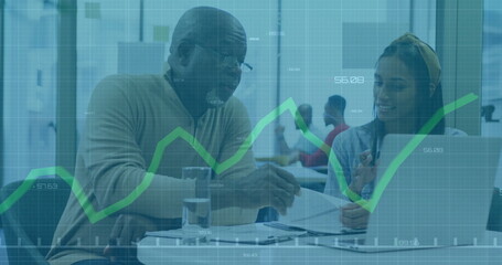 Image of financial data processing over diverse business people in office