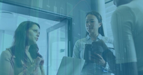 Image of financial data processing over diverse business people in office