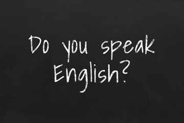 Obraz premium Do You Speak English? text on black chalkboard. Language course