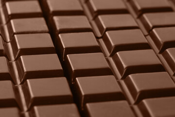 Chocolate bars, closeup. Mocha mousse - color of 2025 year