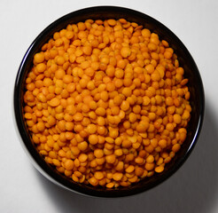 Zenithal photo of red lentils with white background .Healthy legumes.Healthy food. Seasonal legumes. Organic food concept 