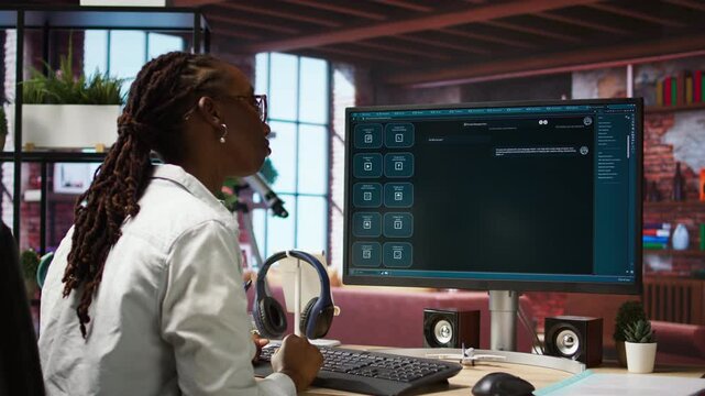 Woman at home asks questions to AI LLM chatbot virtual assistant answering user prompts. Person receiving helpful information from artificial intelligence large language model program on PC, camera A