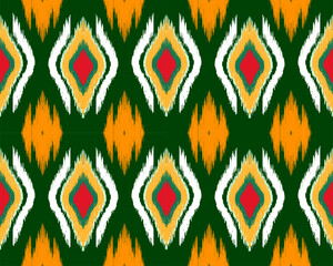 Colorful diamond pattern with green background, orange, red, and white accents creates vibrant and lively design. Perfect for textiles or wallpapers