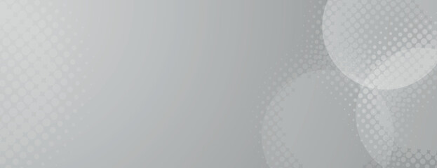 Gray halftone background with a dotted pattern. The background features a smooth texture with overlapping circles, emphasizing the gray color. Minimal halftone vector gradient background