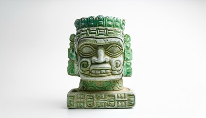Intricate details on a Mayan head sculpture. Green and white hues add to its mystique.