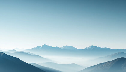 Fototapeta premium Serene mountain landscape under a blue sky with misty valleys.