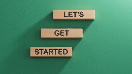Lets get started symbol. Concept words Lets get started on wooden blocks.Business and Lets get started concept. Copy space.3D rendering on green background.