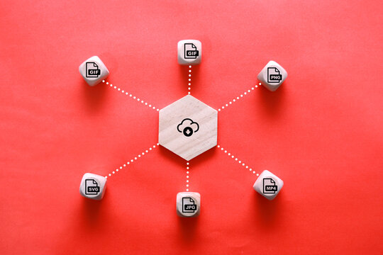 wooden block with save file icon or download file format JPEG, PNG, GIF, PDF, SVG And MP4 file. file icons are arranged into folders. Concept document management system or DMS.