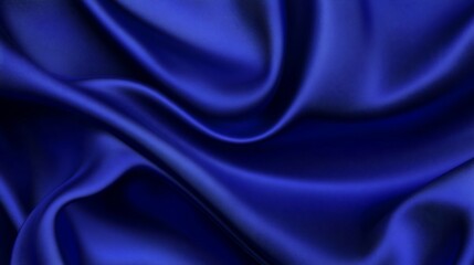 Luxurious royal blue silk fabric with soft, flowing drapes and folds.