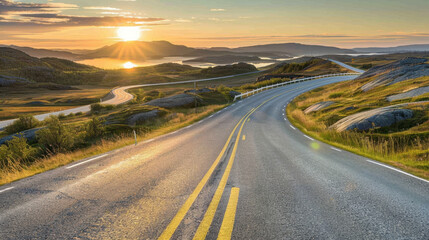 Fototapeta premium winding road through scenic landscape at sunset, with hills and water reflecting golden light. tranquil atmosphere invites exploration and adventure